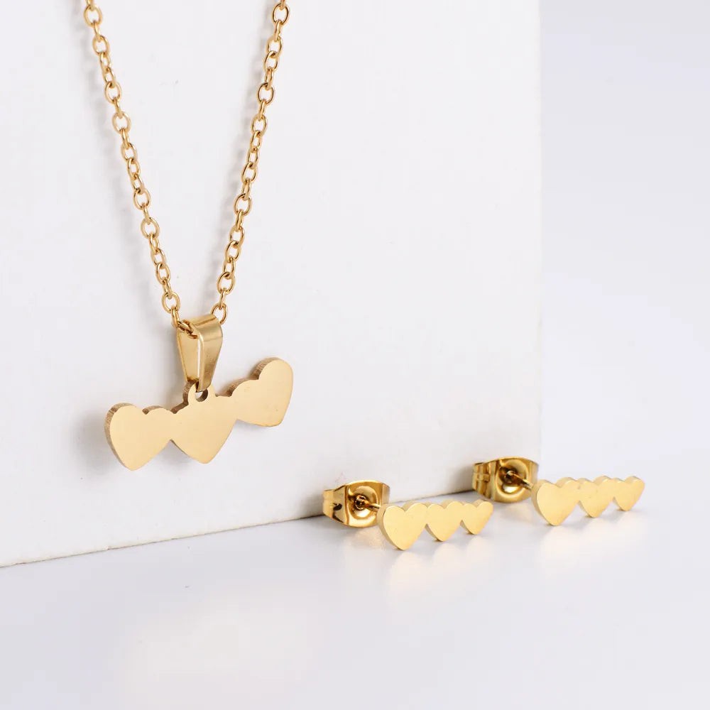 fashion-heart-shape-stainless-steel-polishing-plating-women-s-earrings-necklace-3-piece-set Triple Heart Gold-Plated Jewellery Set β Stainless Steel Pendant & Earrings - Image 1
