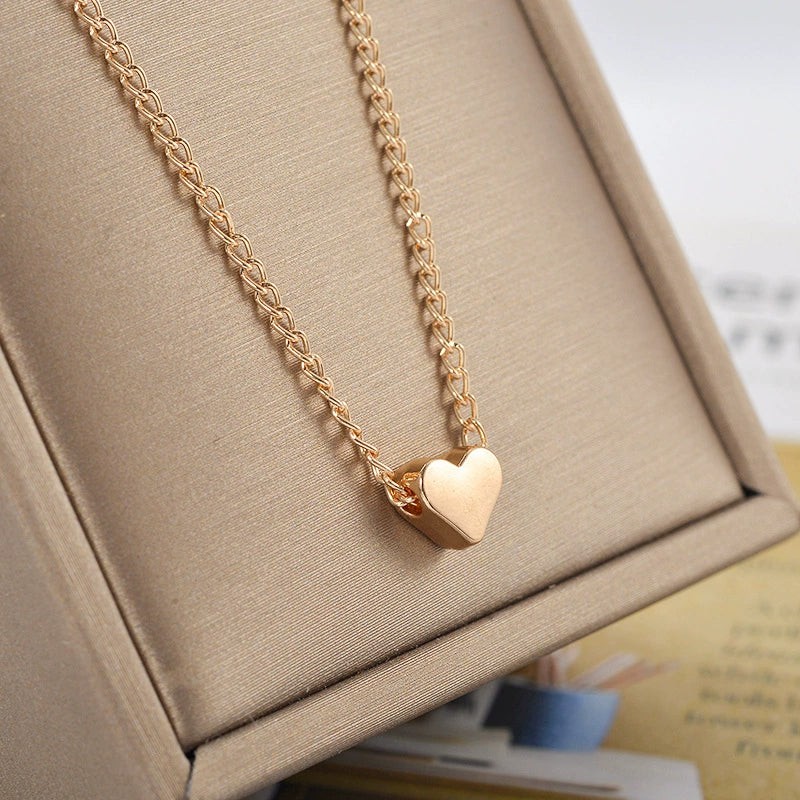 minimalist-heart-shape-alloy-copper-necklace-for-women-with-electroplating-treatment-and-twist-chain-ideal-as-fashionable-small-gifts Golden Minimal Heart Necklace - Image 1